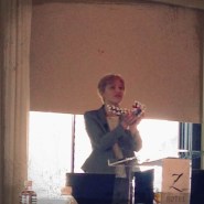 Tatiana Kononov showing us a model of a peptide molecule featured in several of  Revision® Skincare products!